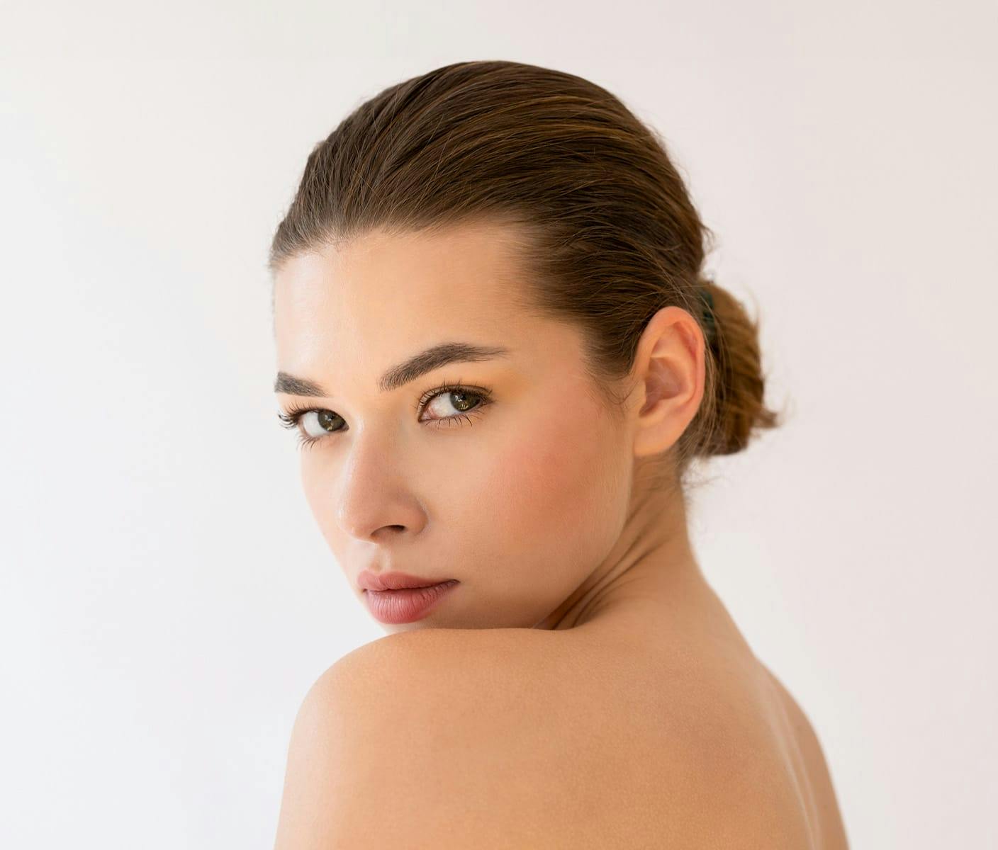 woman looking over her shoulder