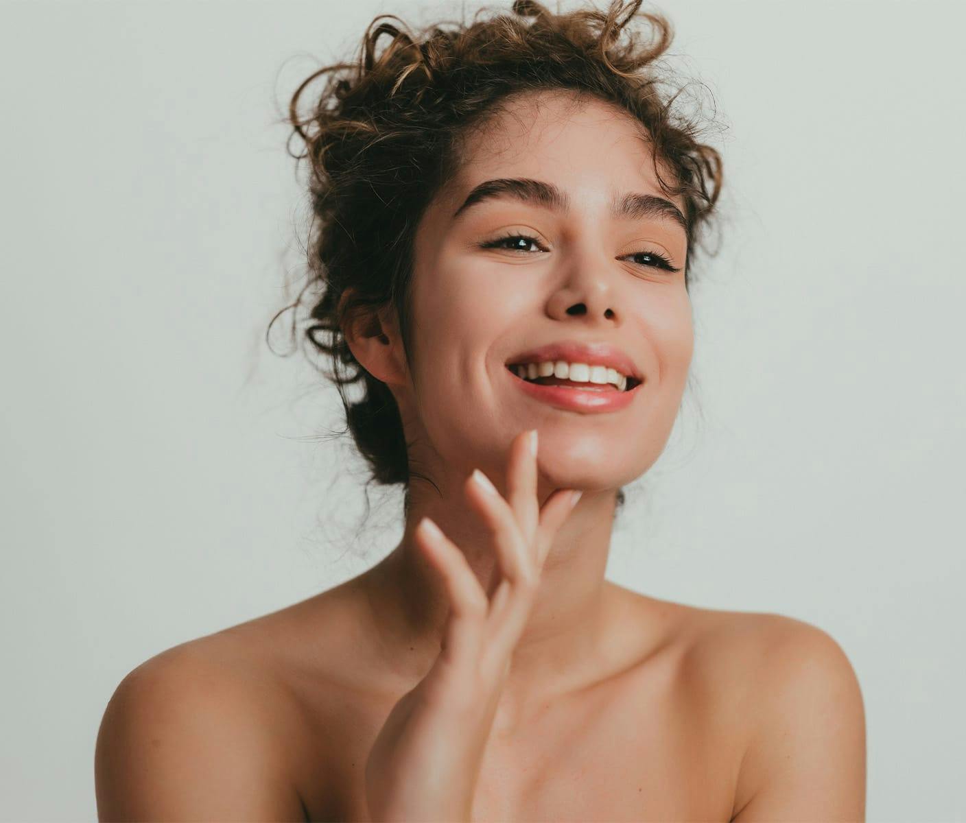 woman with curly hair smiling