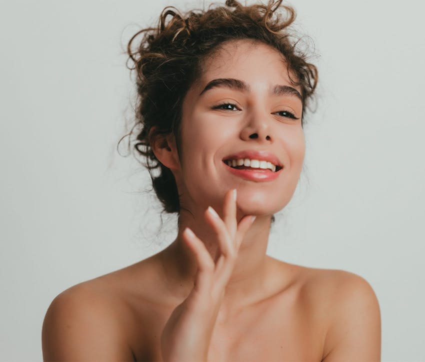 woman with curly hair smiling