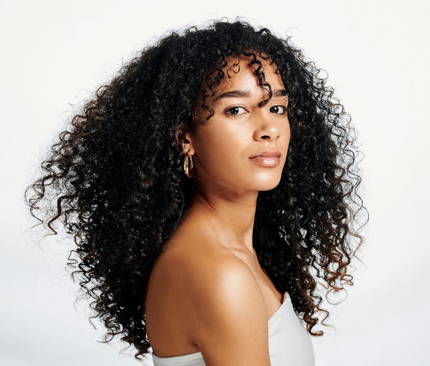 woman with long curly dark hair