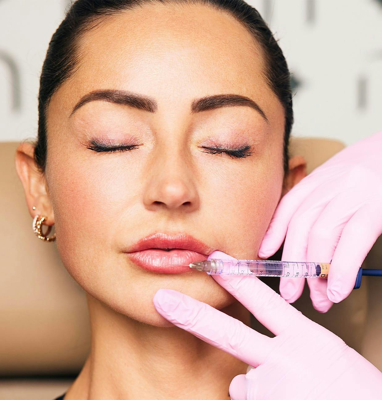 woman getting lip injections