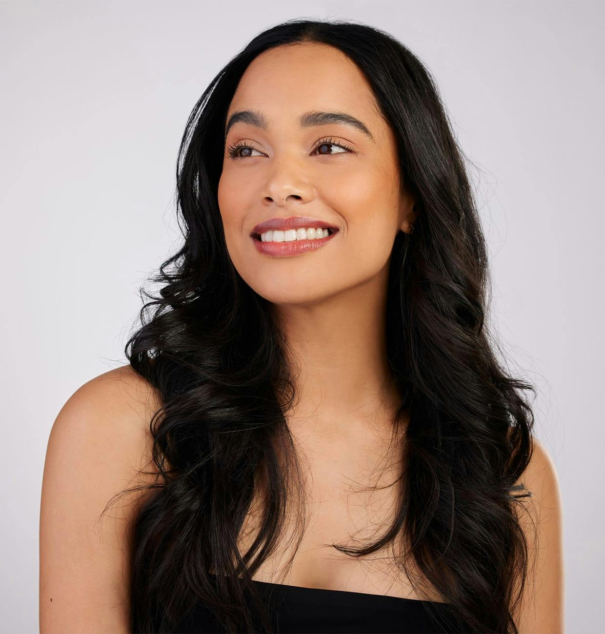 woman with long dark wavy hair