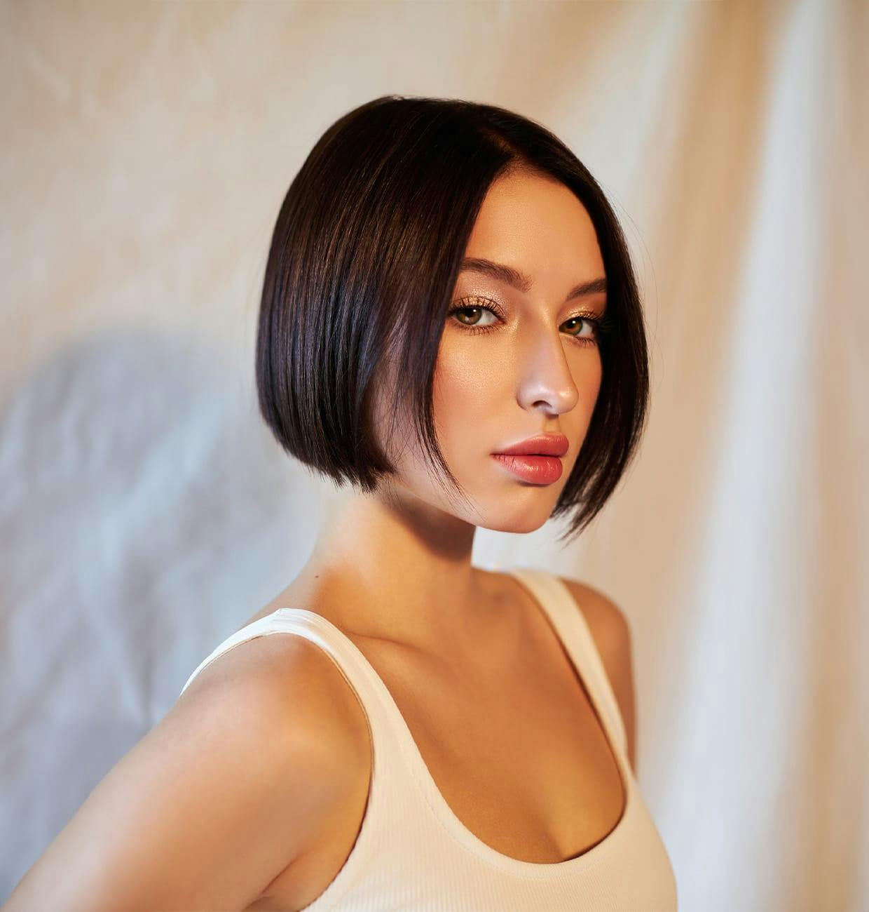 woman with dark chin length hair