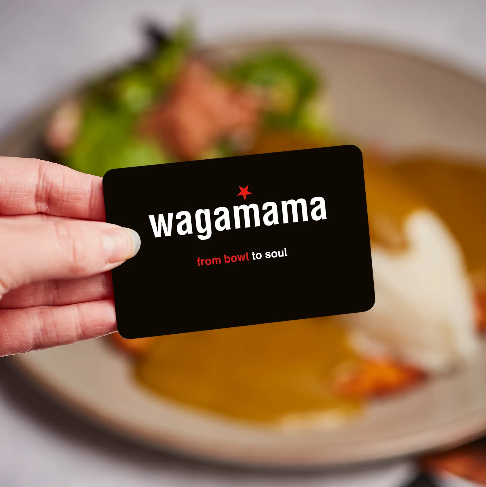 hand holding wagamama gift card