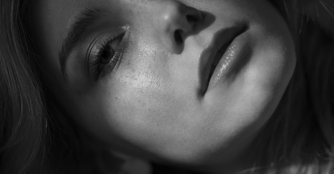 black and white image of a woman's face
