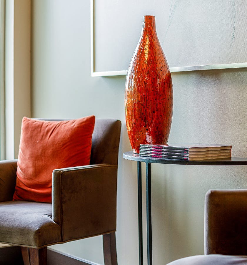 red vase on a side table