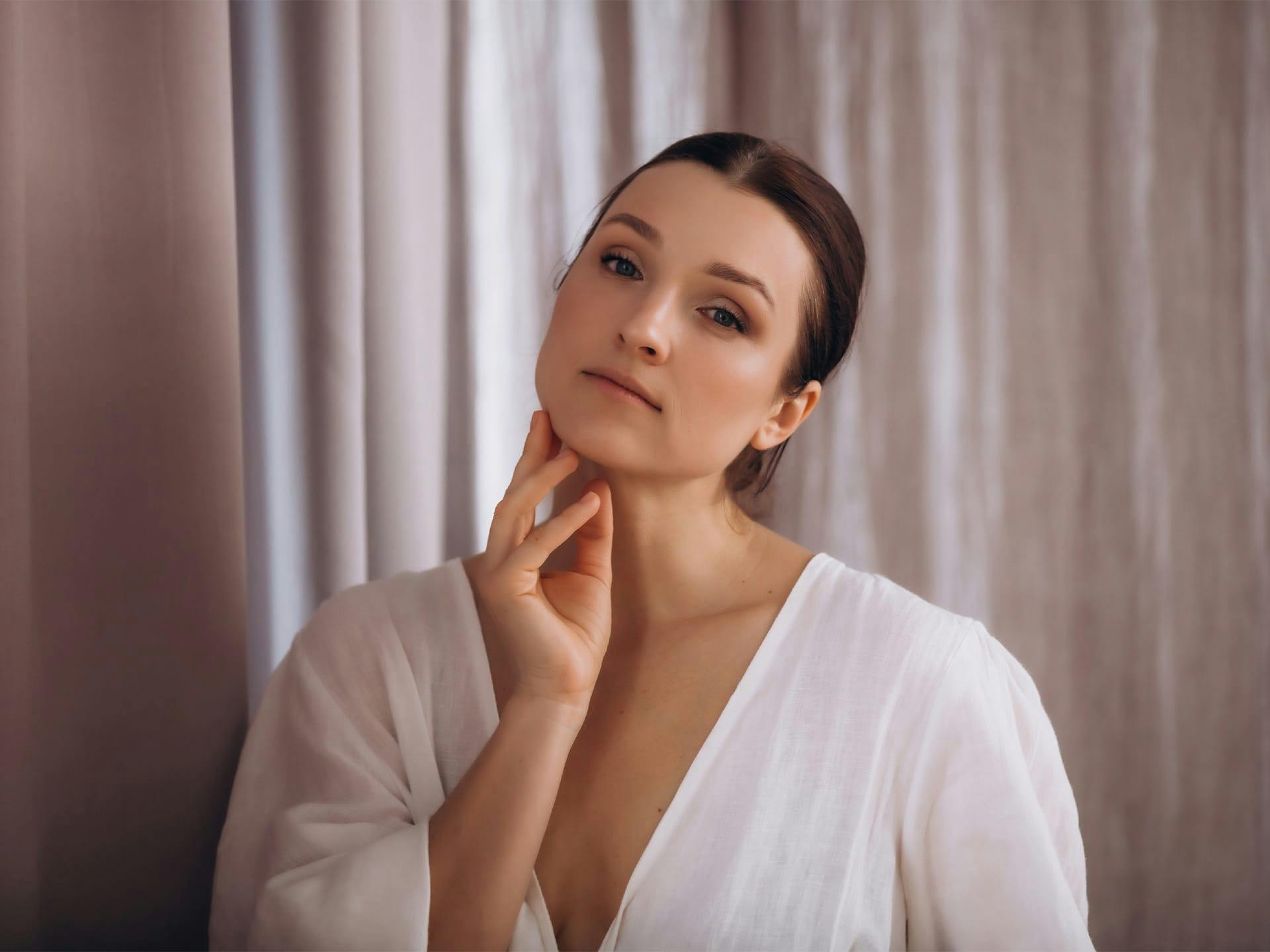 woman touching her chin