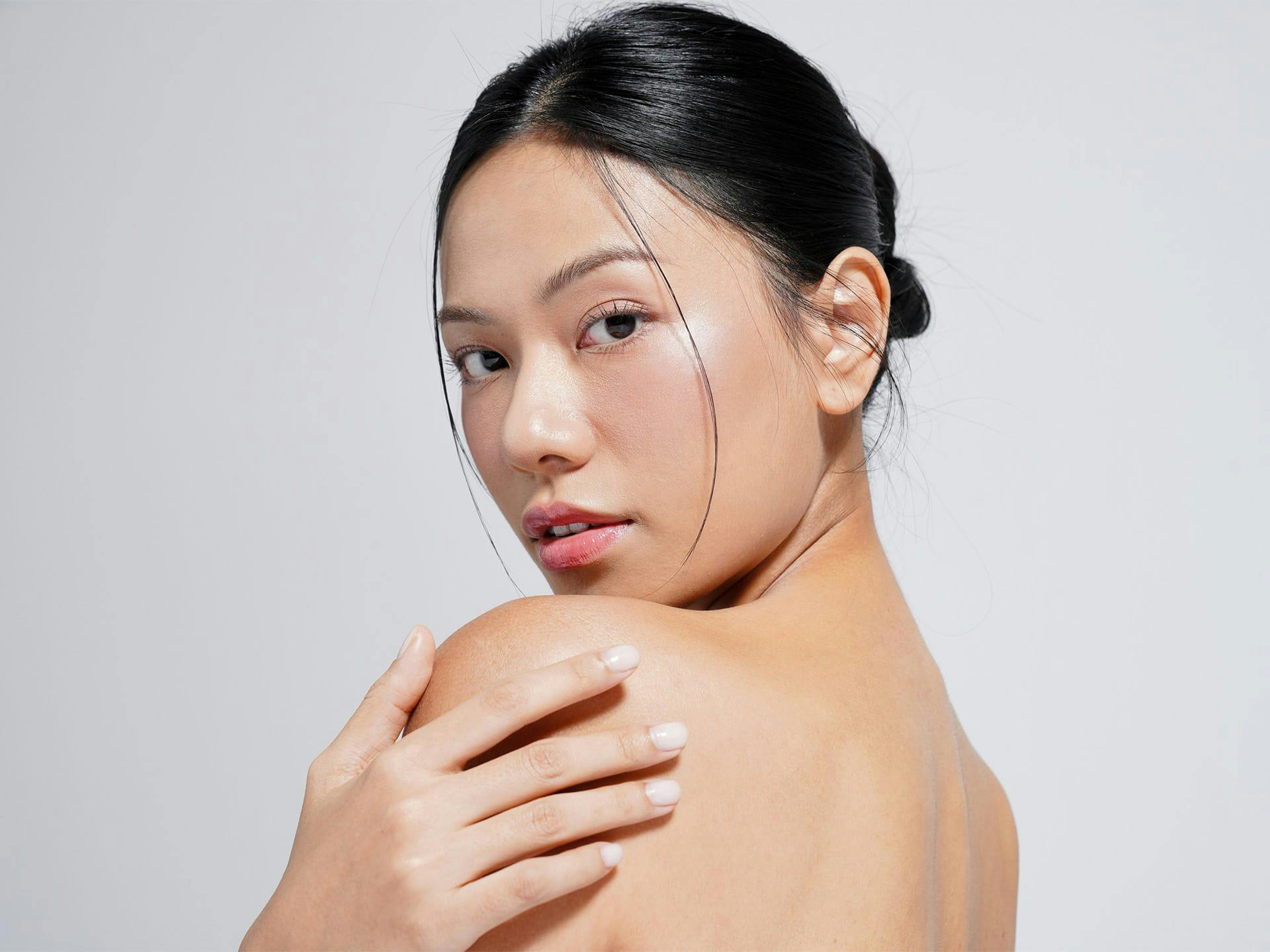 woman looking over her shoulder