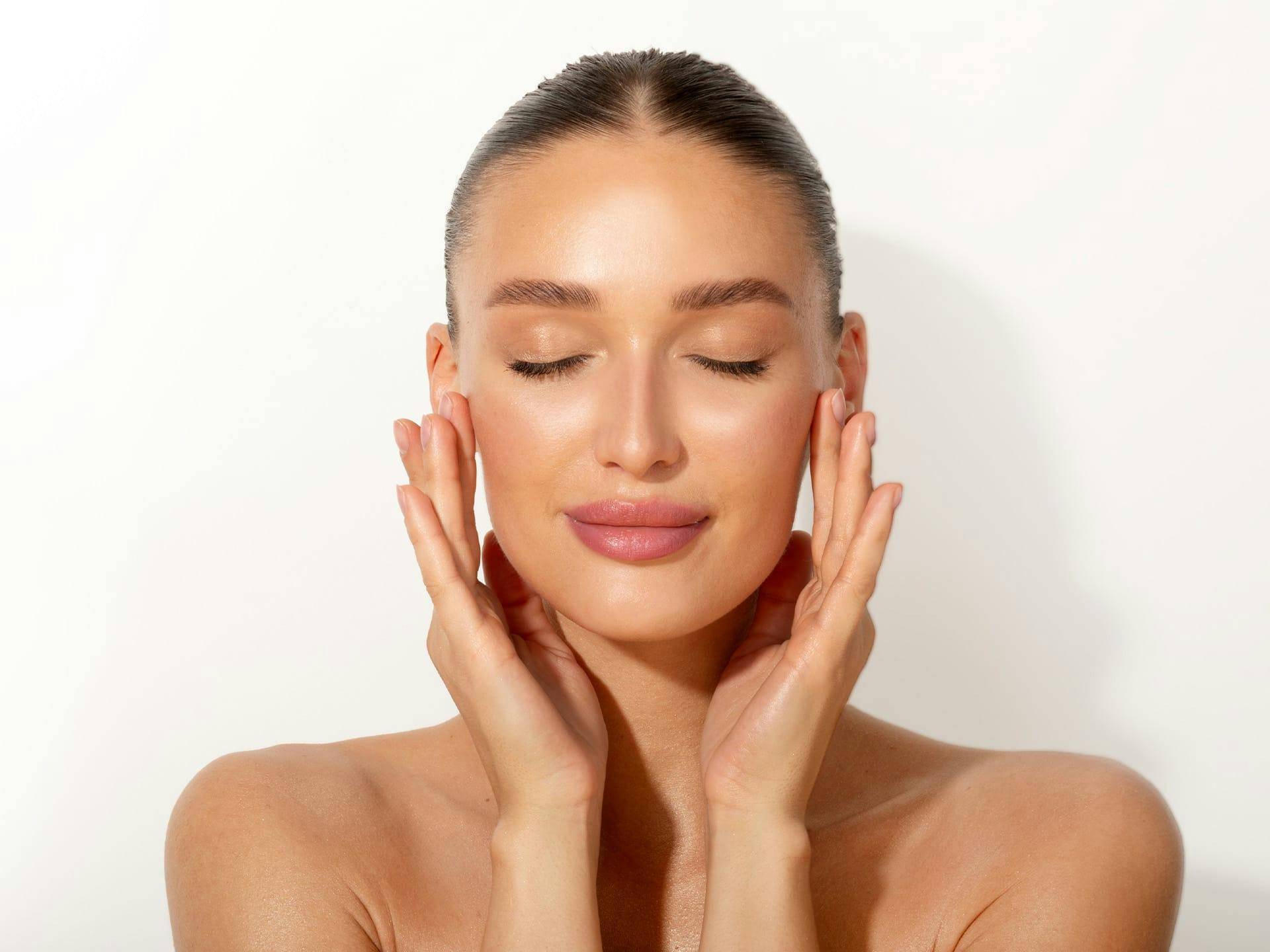 woman touching her face