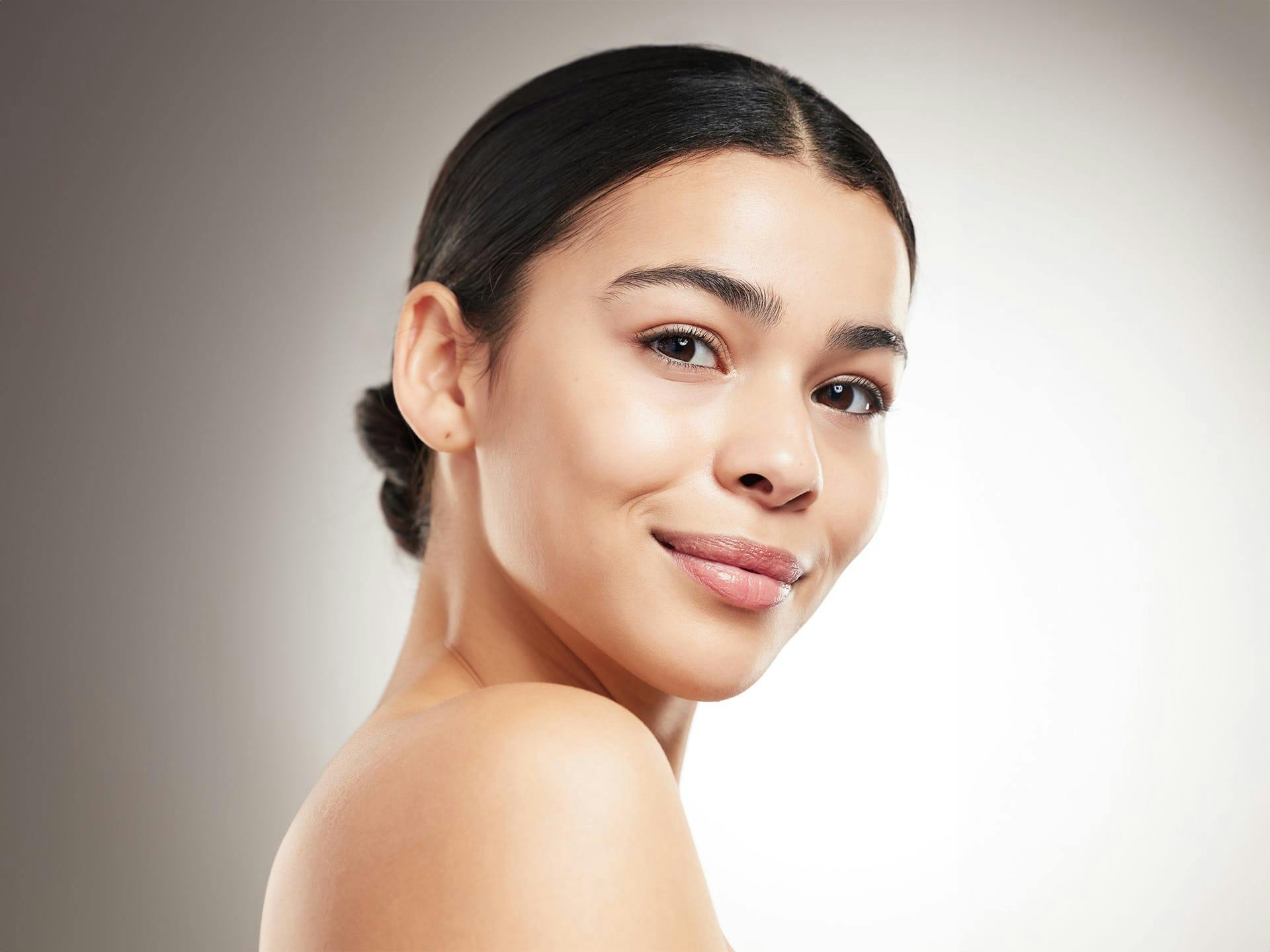 woman smiling over her shoulder