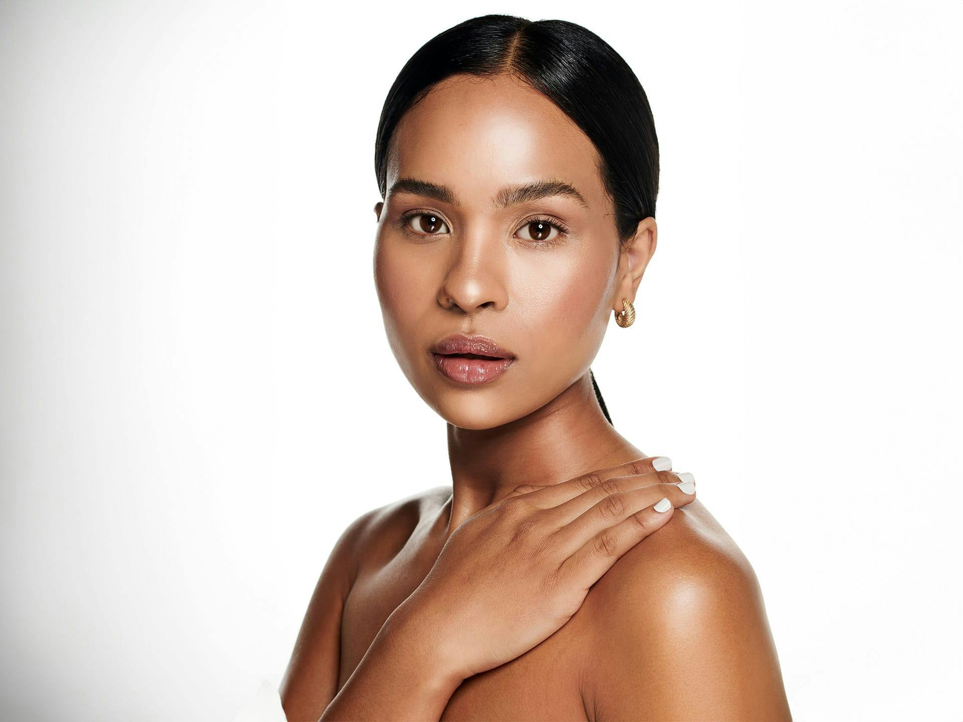 woman touching her shoulder