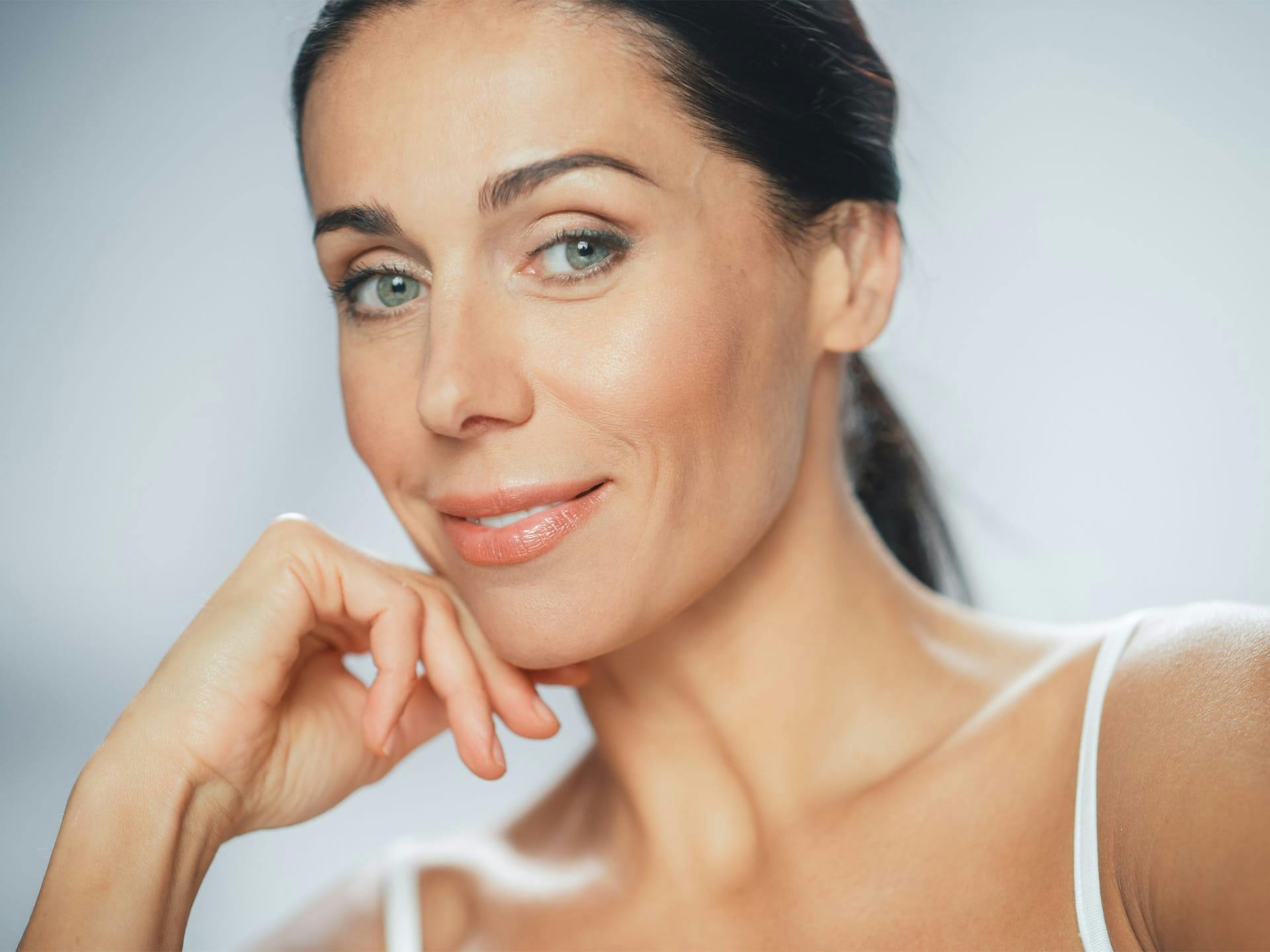 woman touching her chin