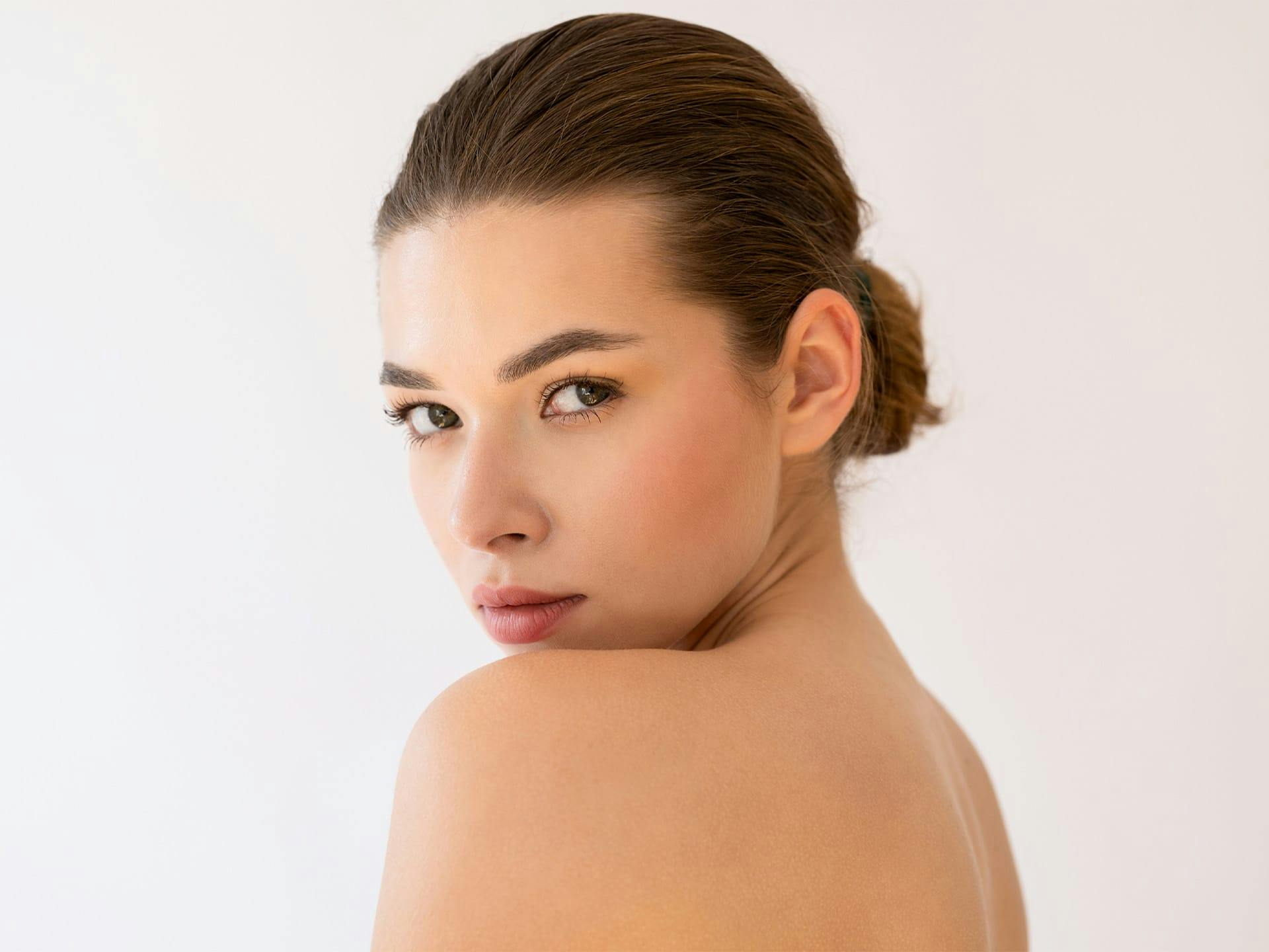 woman looking over her shoulder