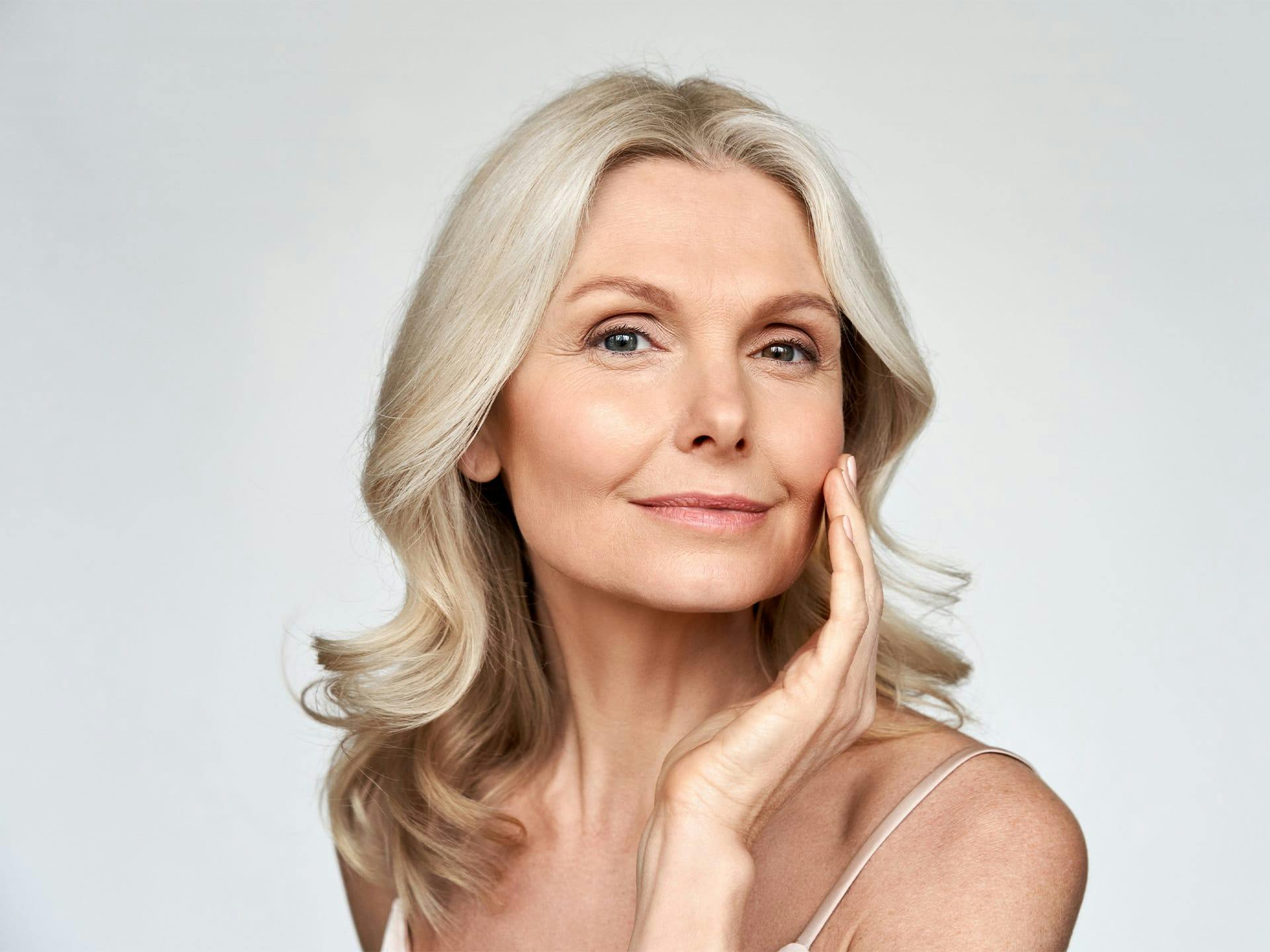 woman touching her face