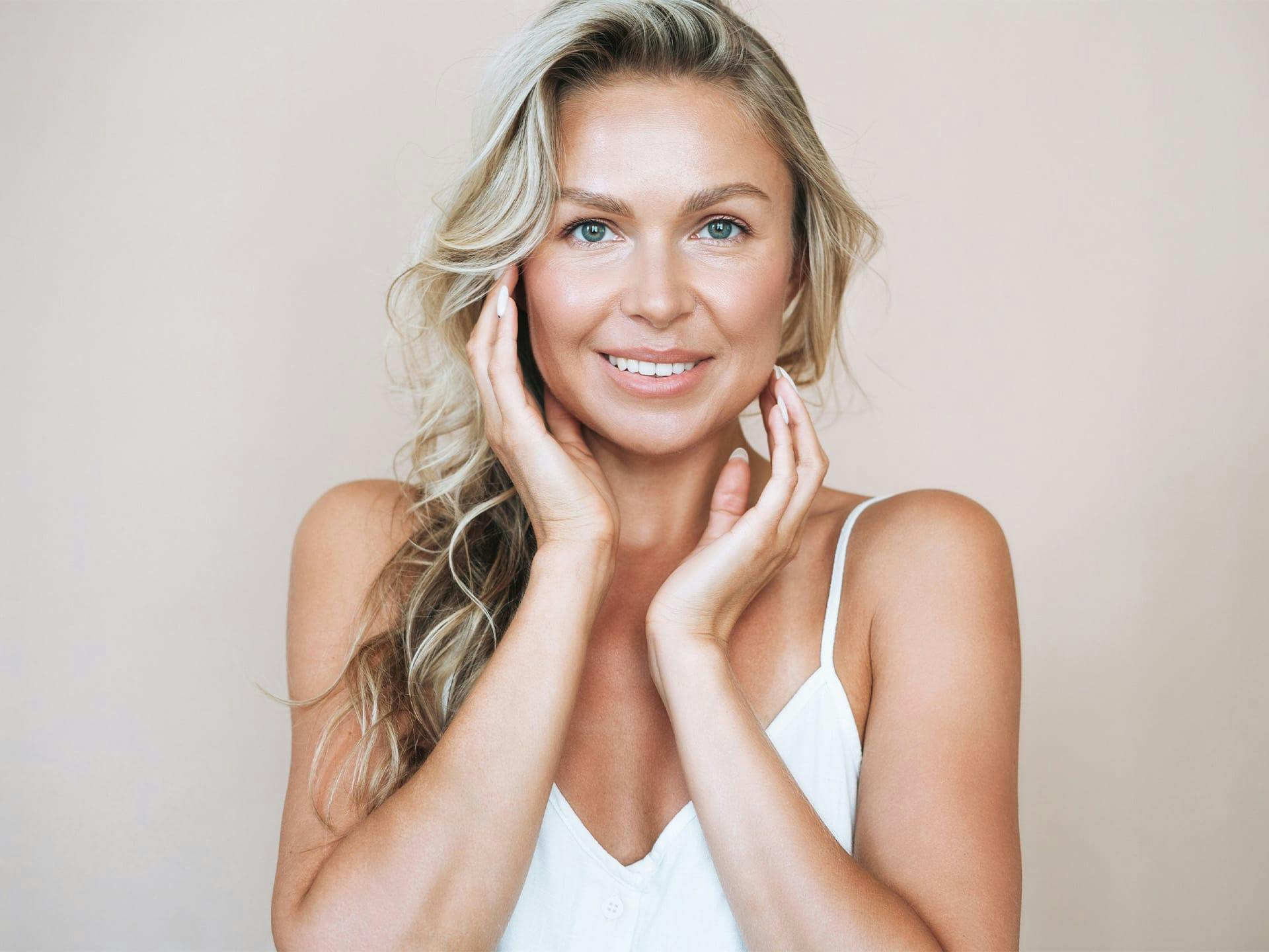 woman touching her face