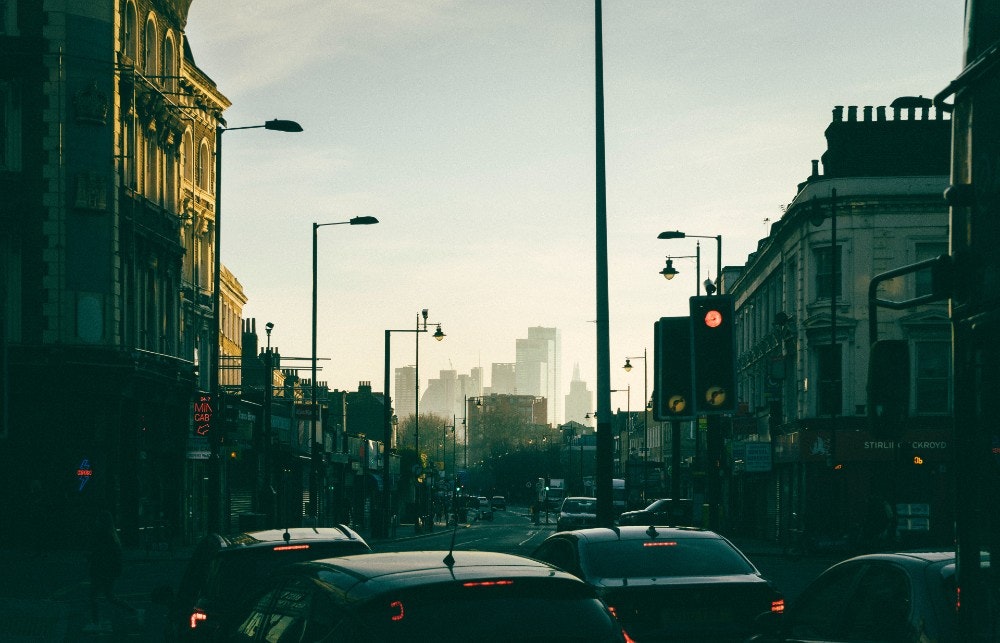 City street view of London with Canary Wharf in the background