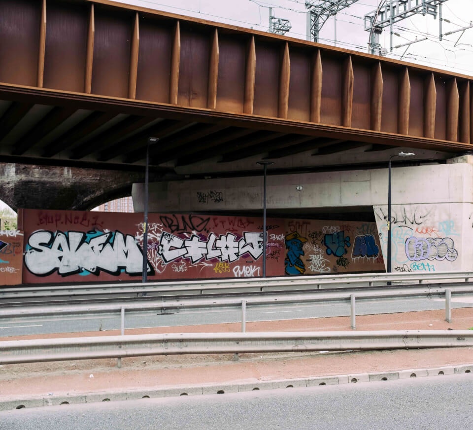 Underside pass covered in graffiti close to Pirate Studios Salford