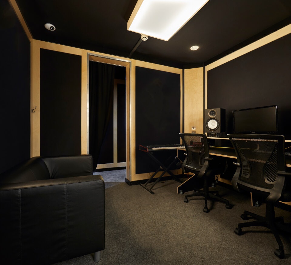 A typical voice over studio. Studio monitors, audio interface, condenser microphones and more provided free in all audio recording studios