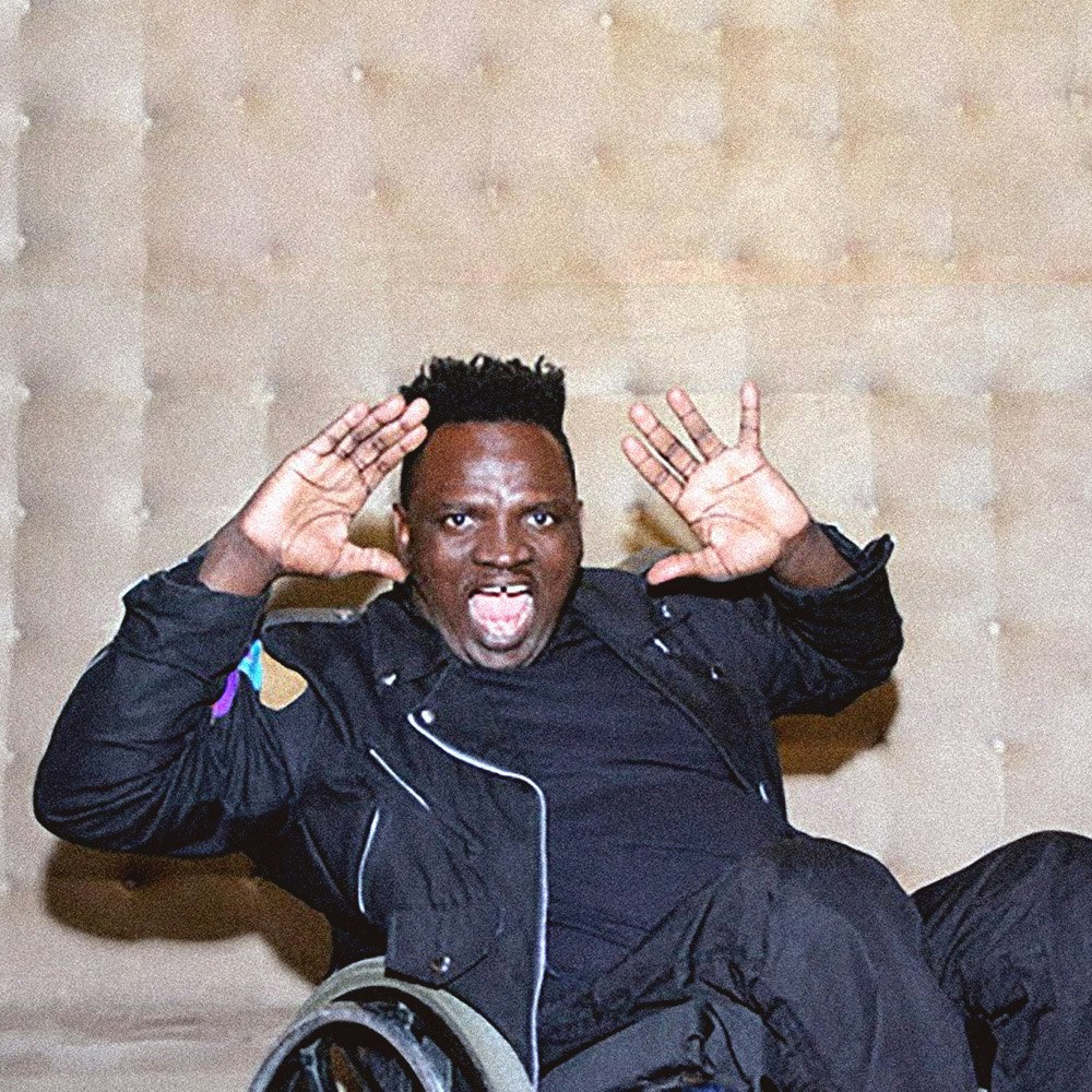 This image may contain: chair, furniture, person, human, wheelchair