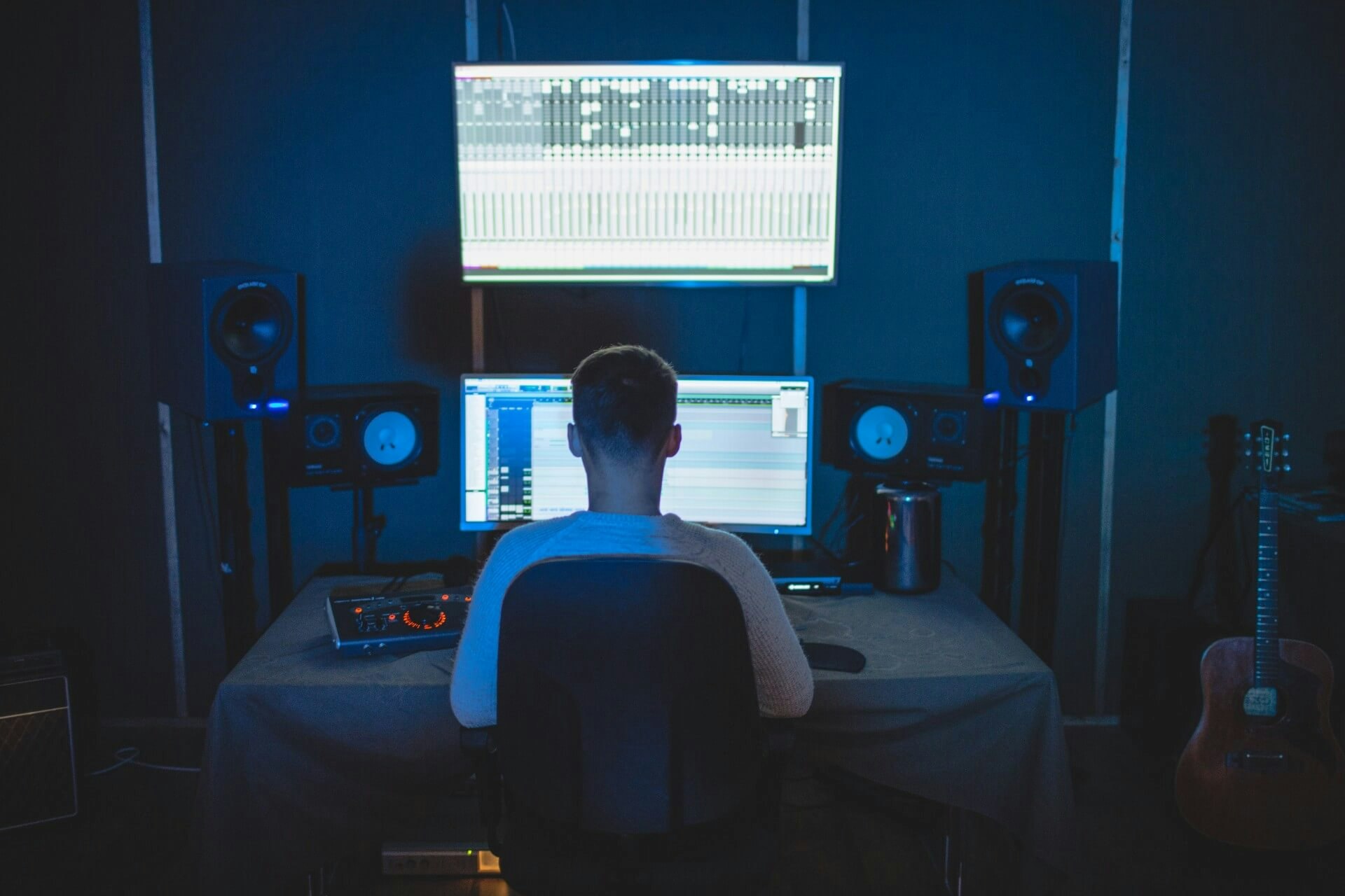Producer using a recording studio for music production in NY