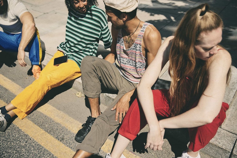 Pirate artists sitting down outside a Pirate location
