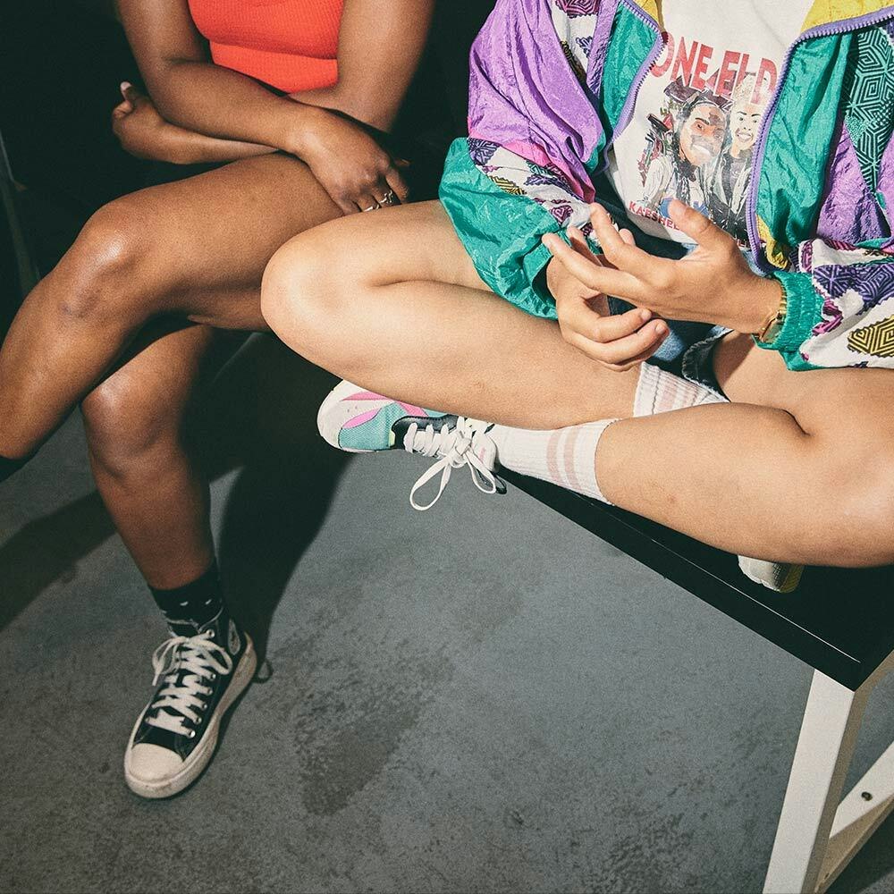 Two people sitting on a bench