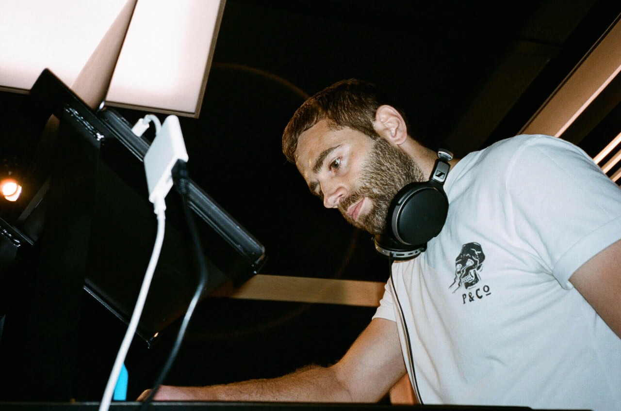 DJ using Pioneer CDJs and mixer inside DJ studios. DJ studio hire from Pirate Studios.