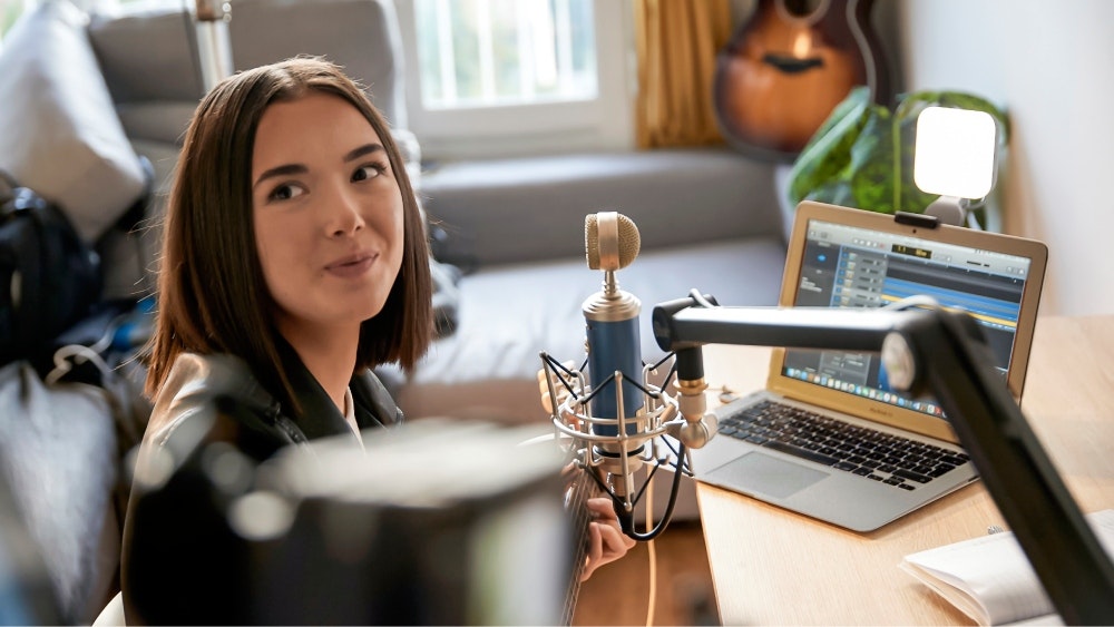 Woman recording and producing
