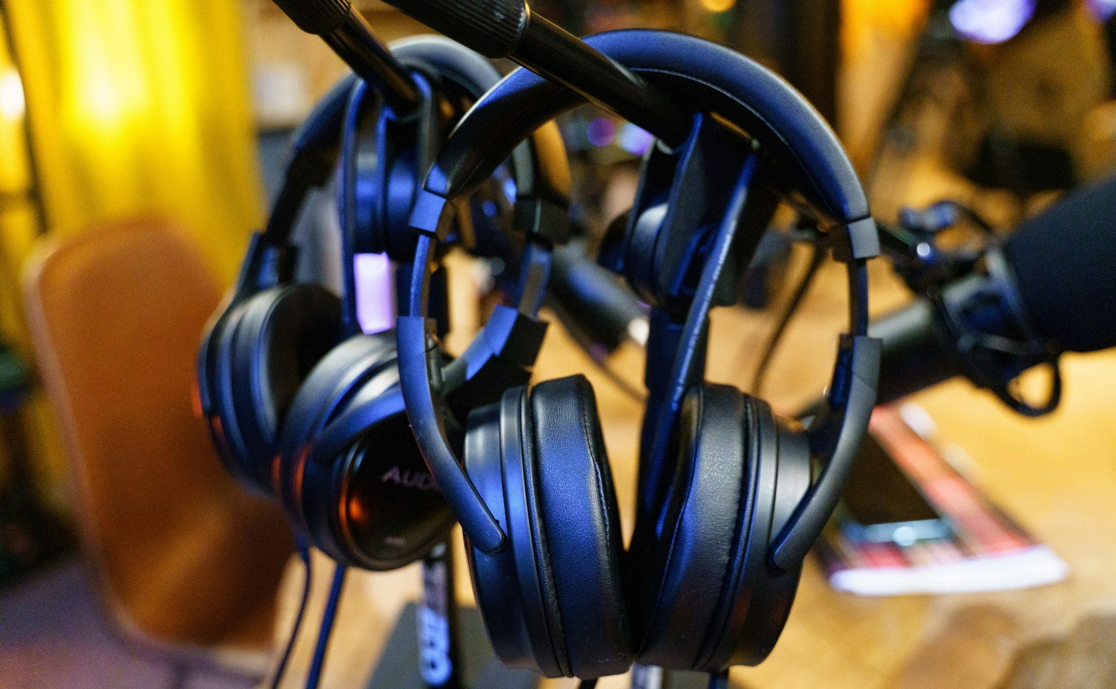Headphones hanging up in a recording studio.