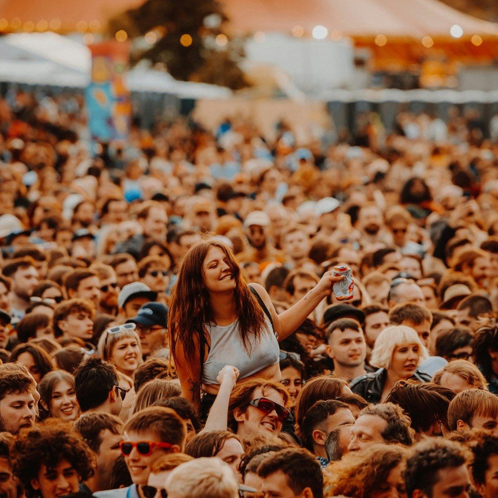 This image may contain: crowd, person, accessories, sunglasses, concert, glasses, face, head, people