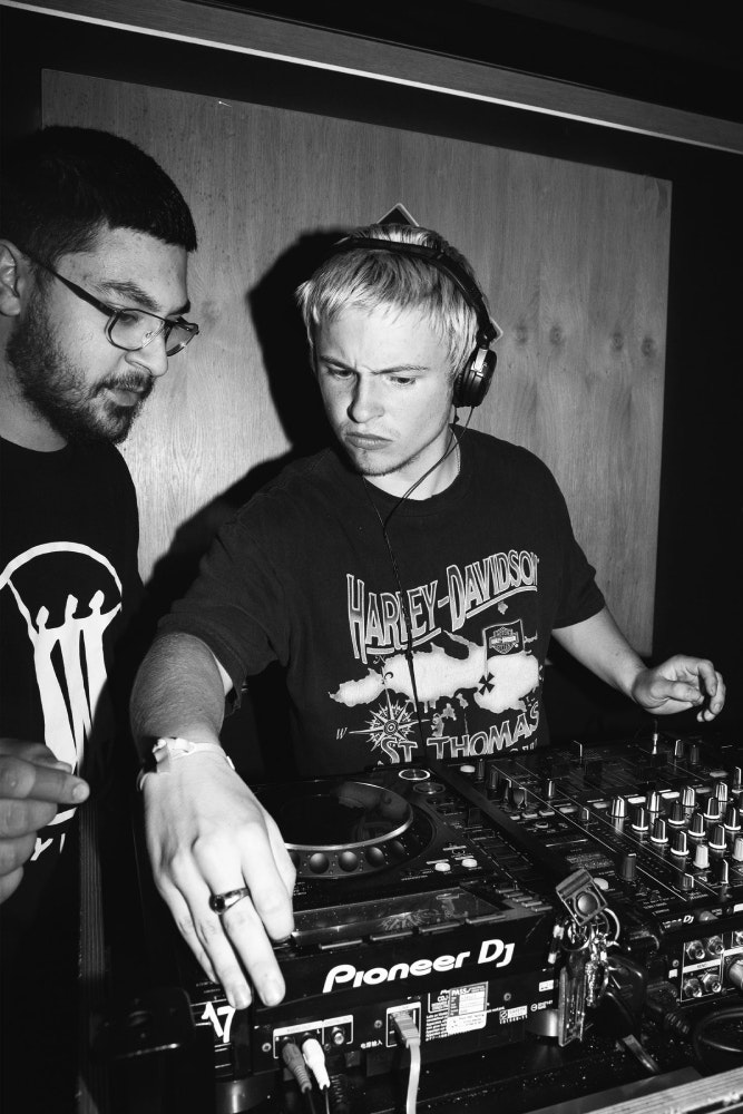 2 DJs using the DJ decks at Pirate Studios