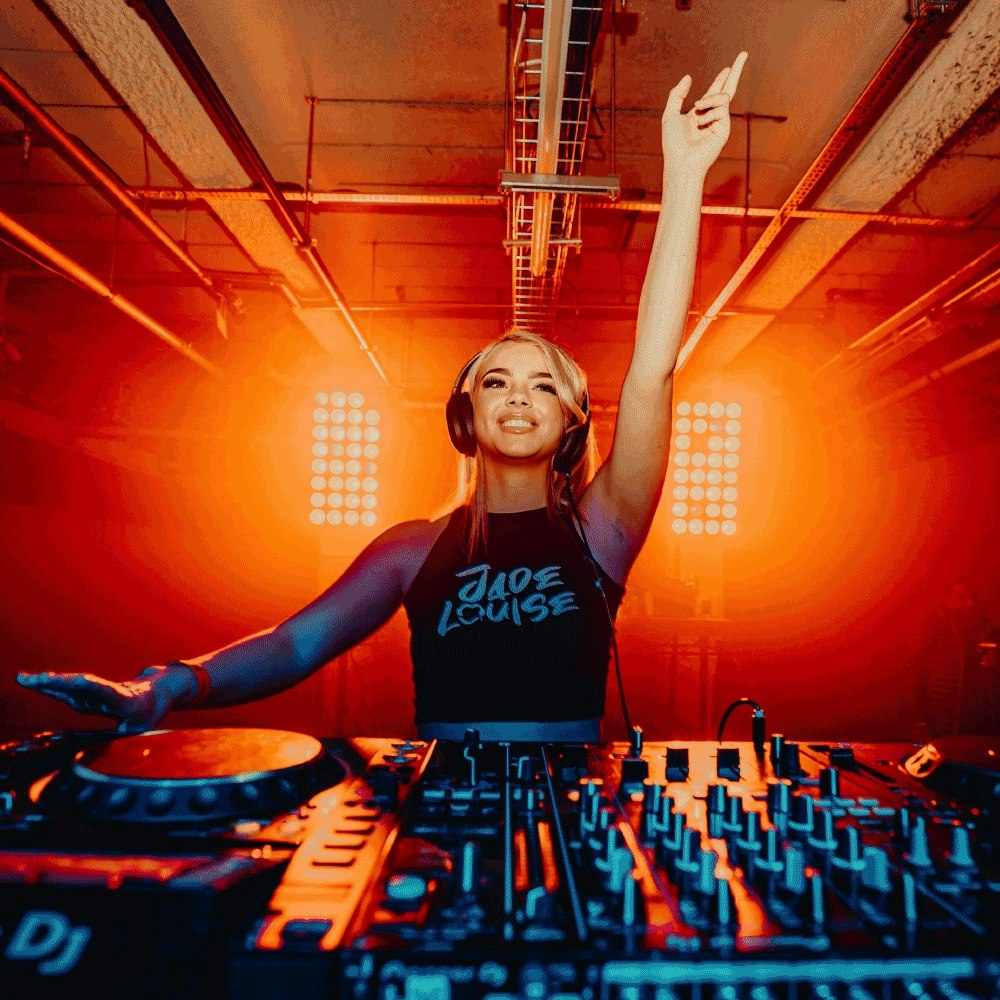 This image may contain: dj, person, female, girl, teen, clothing, glove, face, head