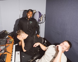 This image may contain: person, adult, male, man, electronics, headphones, computer keyboard, hardware, piano, face