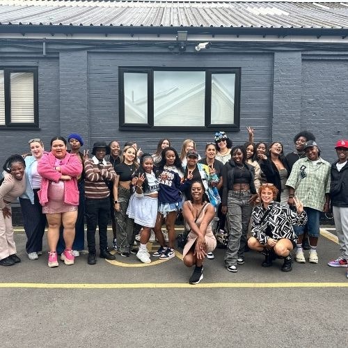 This image may contain: people, person, shoe, hat, adult, female, woman, pants, groupshot, handbag