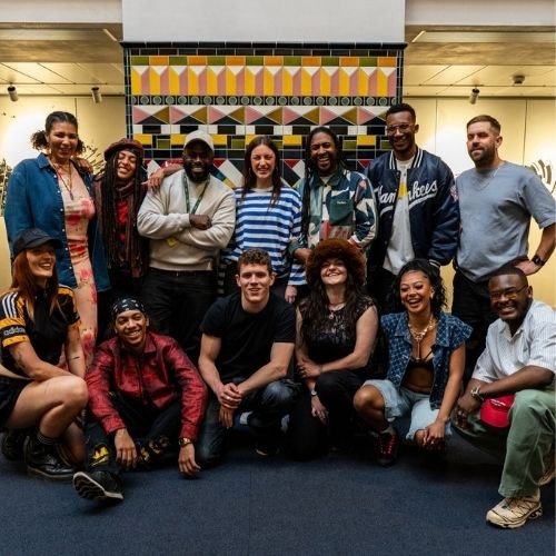 This image may contain: people, person, pants, team, hat, groupshot, shoe, adult, male, man