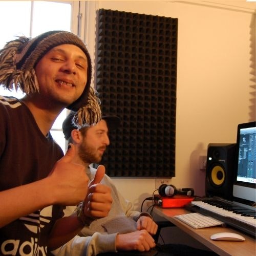 This image may contain: piano, speaker, headphones, computer keyboard, person, portrait, adult, male, man, finger