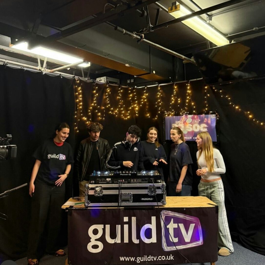 This image may contain: adult, female, person, woman, people, lighting, desk, male, man, shoe