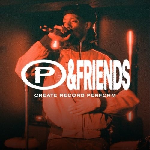 This image may contain: microphone, lighting, photography, adult, male, man, person, hat, portrait, solo performance