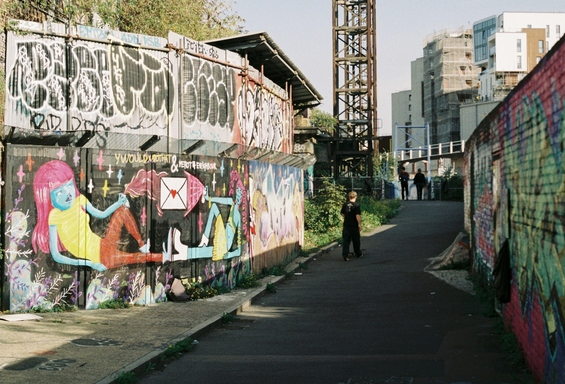 This image may contain: city, road, street, urban, person, berlin wall memorial, landmark