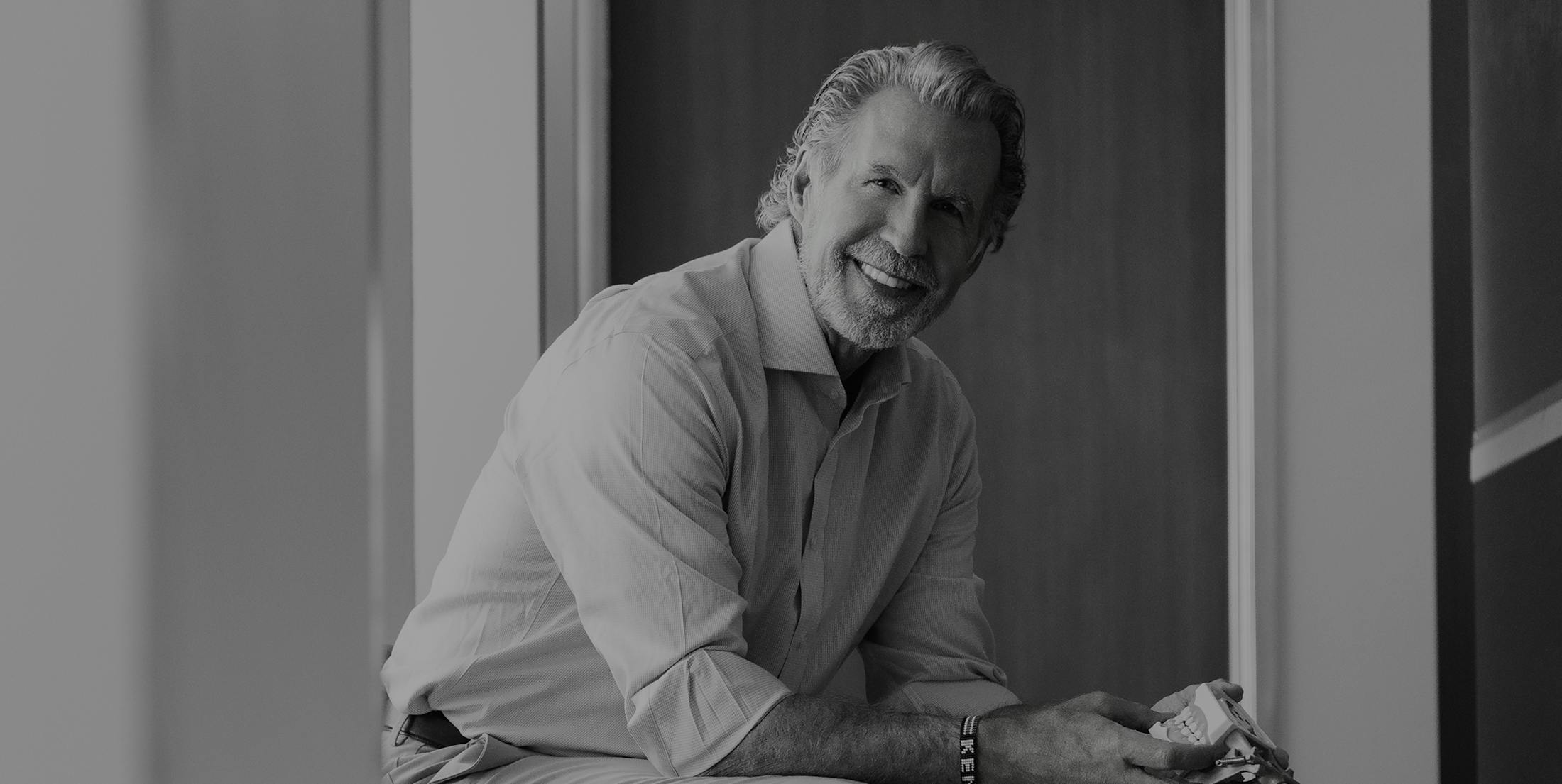 Dr Paul O'Malley sitting down