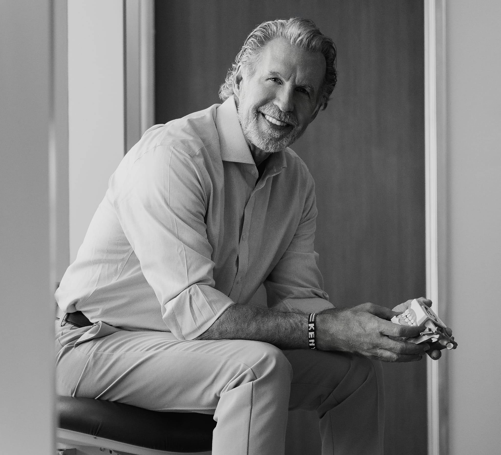 Dr Paul O'Malley sitting down