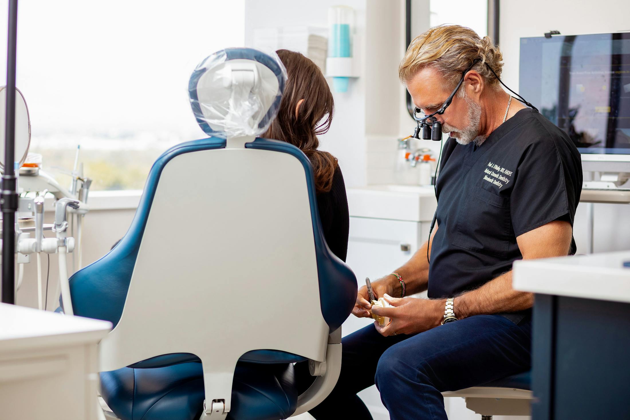 Dr. Paul O'Malley with patient