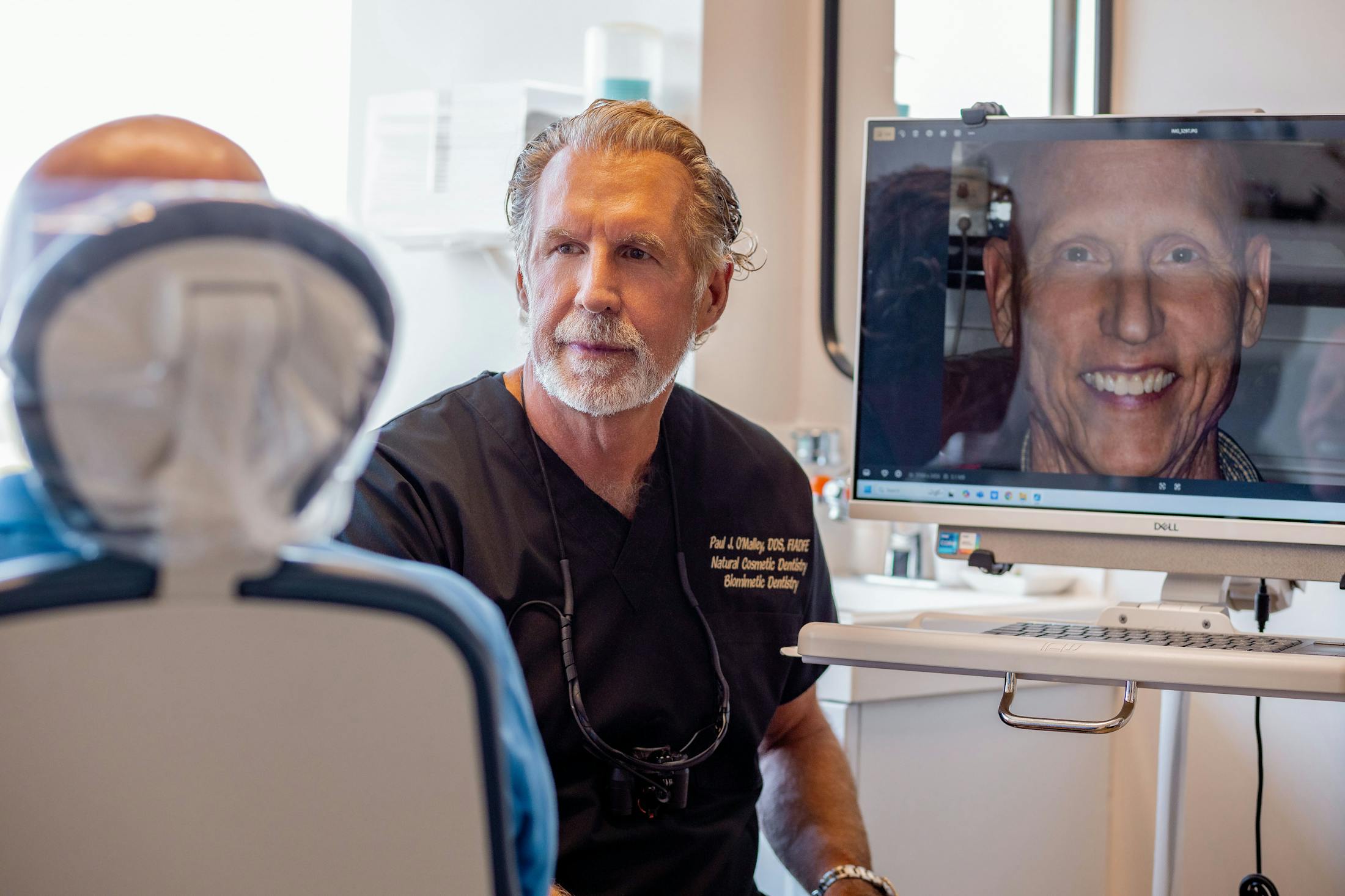 Dr. Paul O'Malley talking to male patient