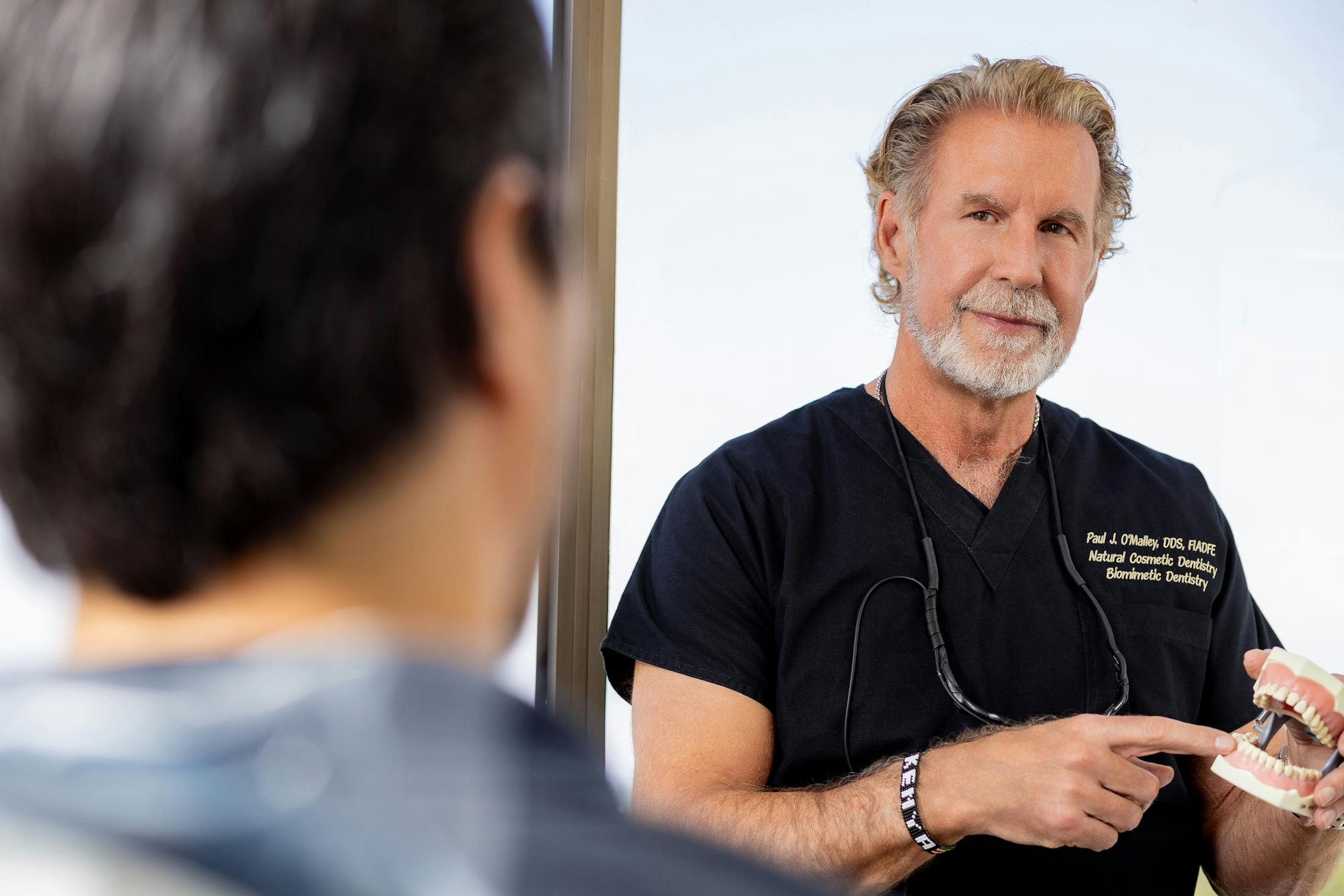 Dr. Paul O'Malley showing patient teeth example