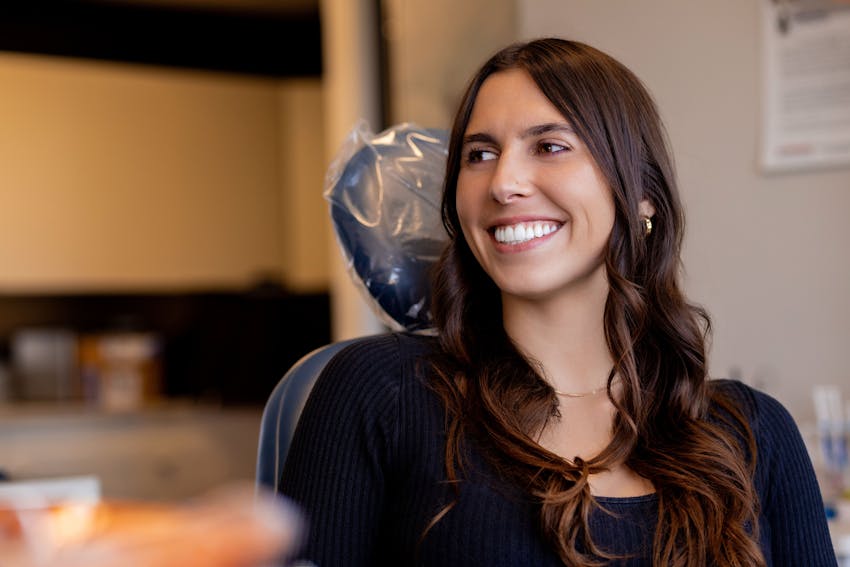 woman sitting and smiling