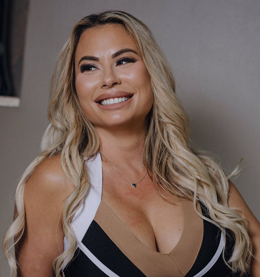 woman smiling while looking to the side