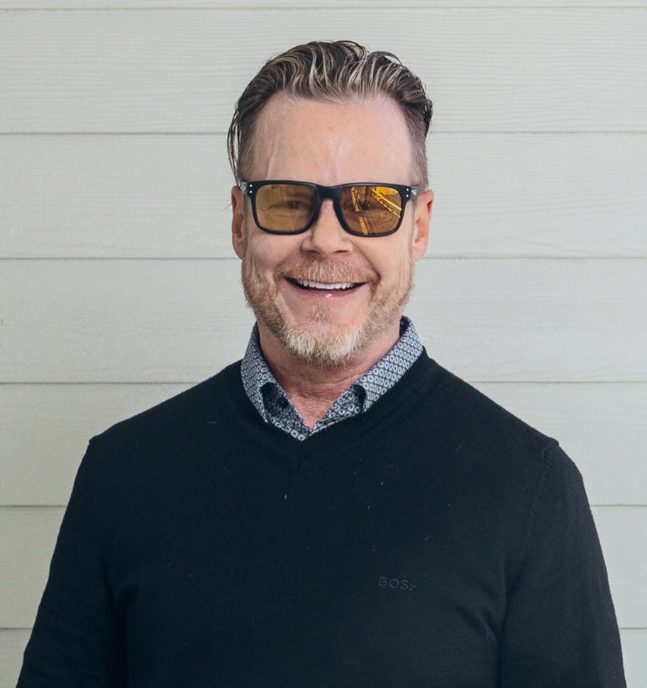 man wearing yellow toned sunglasses