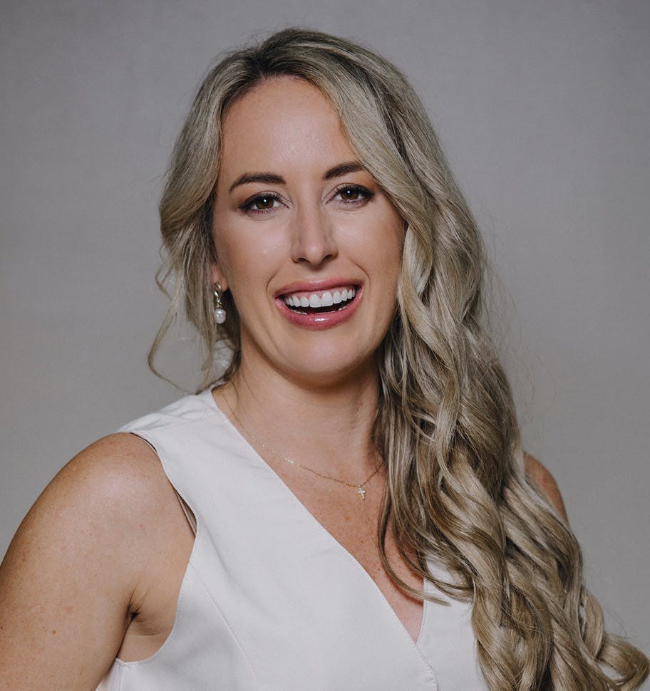 woman with wavy hair smiling