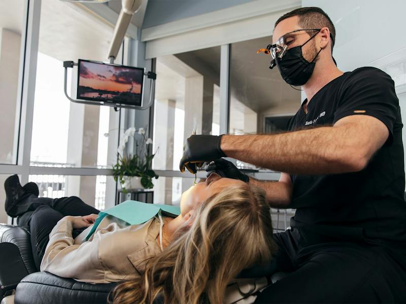 staff member filling a patient's cavity