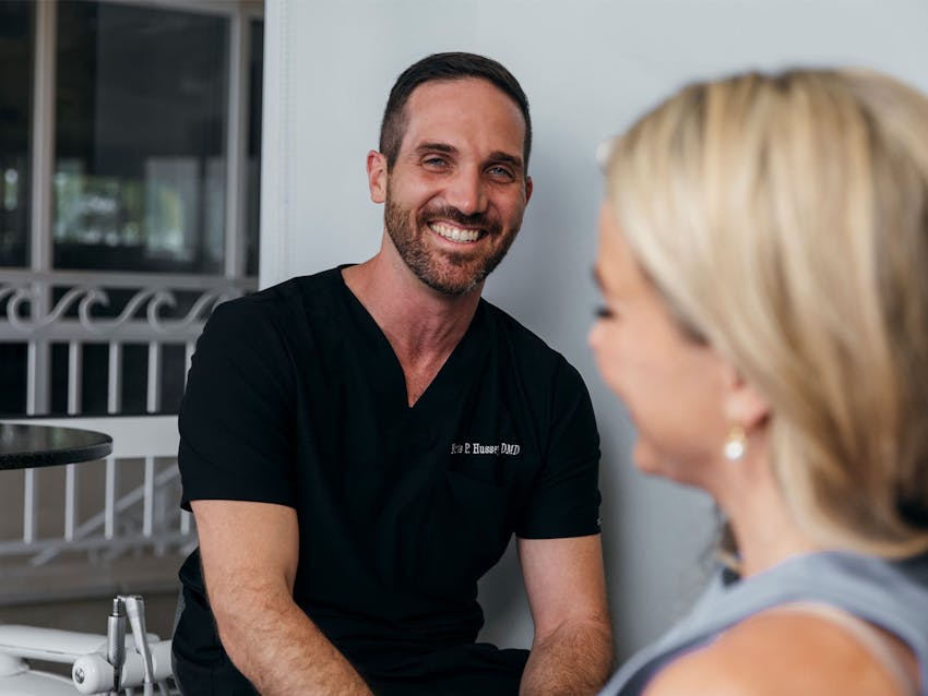 staff member smiling at patient